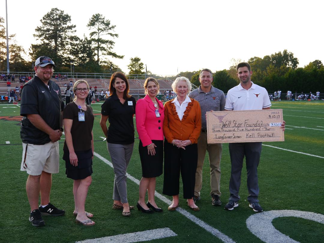 Kell High School Football Team Honors Legendary Coach With Donation To WellStar Foundation